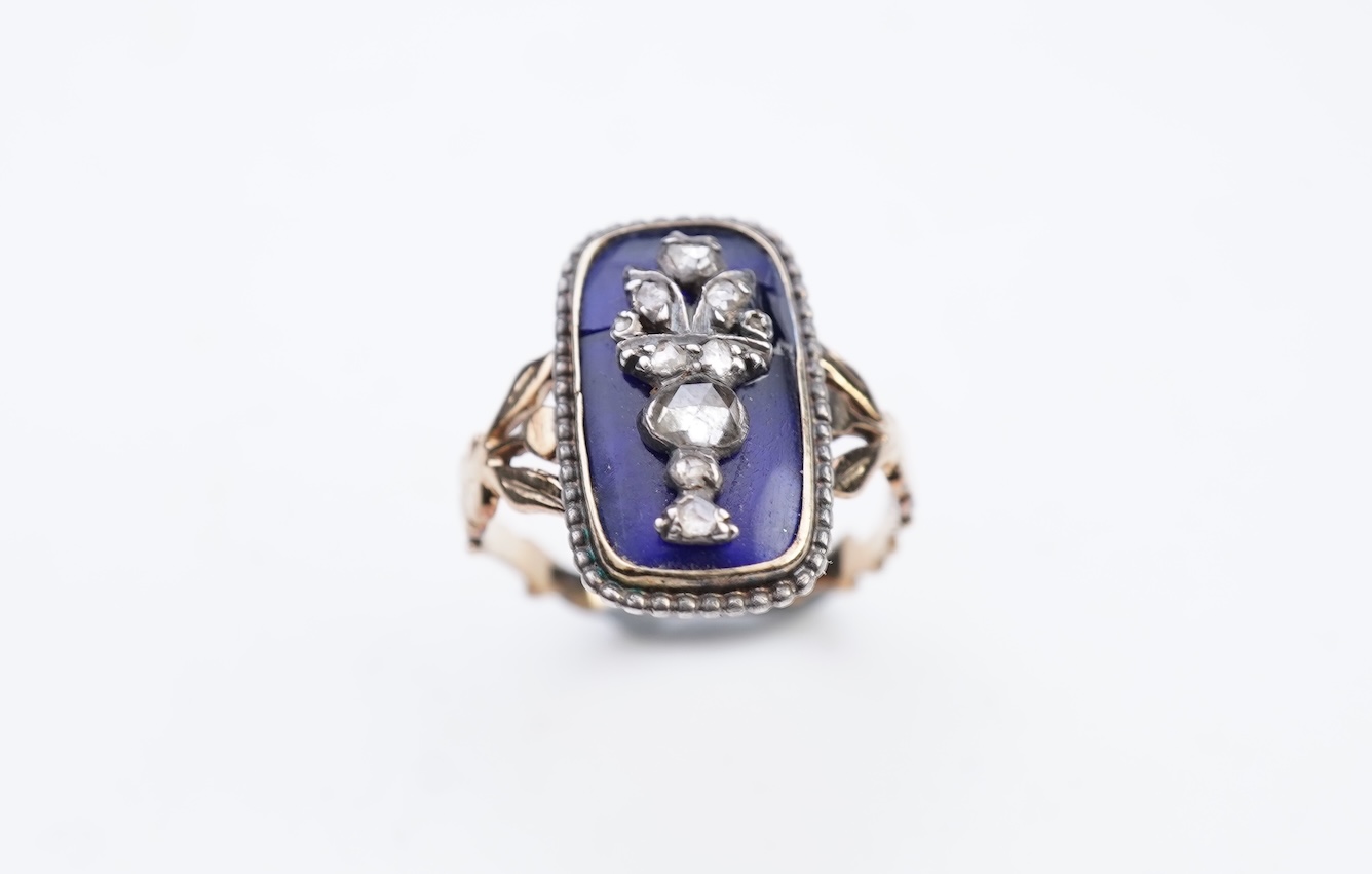 A diamond and blue glass ring